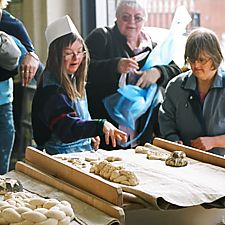 Photo: visitors with loaves
